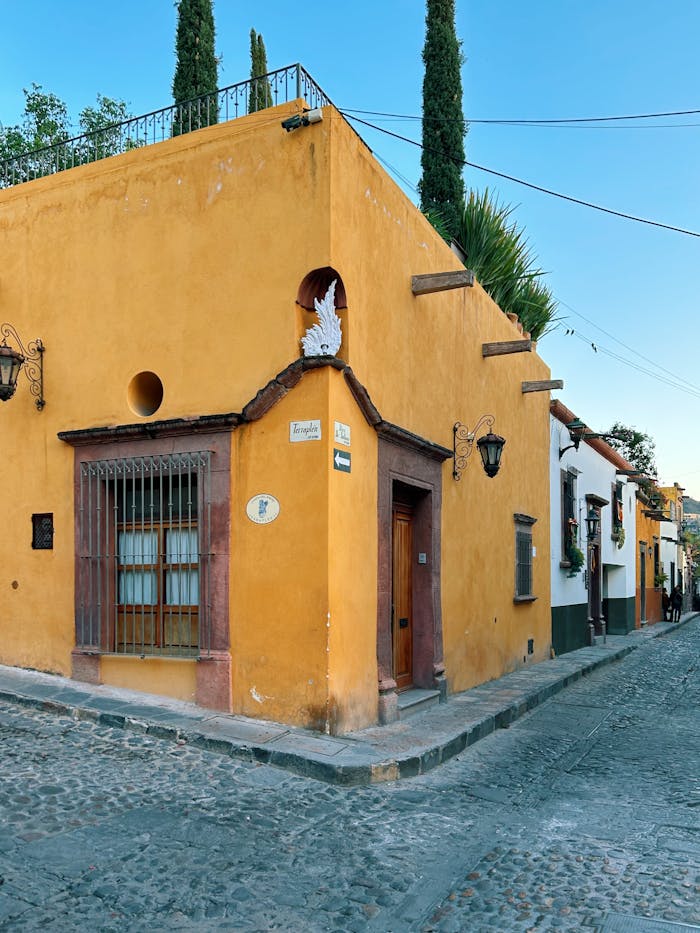 Mastering the First Impression: Your intriguing post title goes here Yellow facade on a cobblestone street corner in San Miguel de Allende, Mexico.