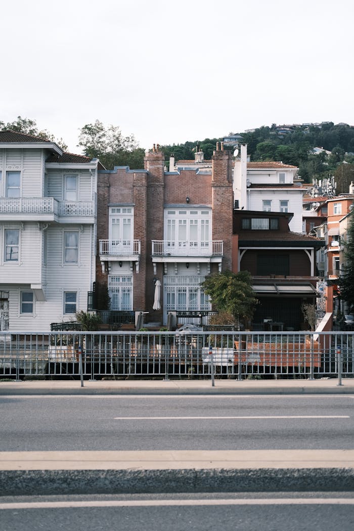 Discover a serene street view capturing historic residential architecture in Istanbul.